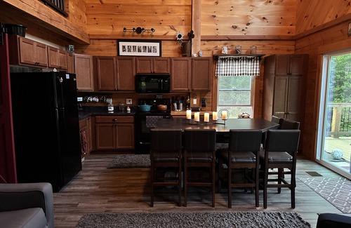 Stark Cabin | Ride right from this trailside cozy cabin in the woods with private pond.