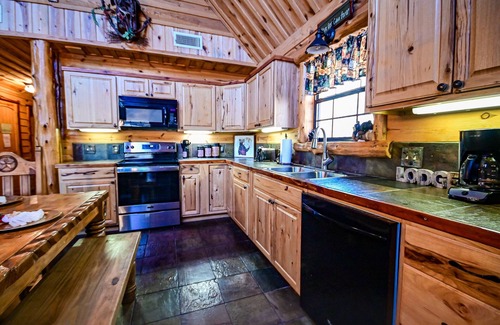 Board Camp Cabin | Ride to the trails from this secluded Luxury Cabin in Wolfpen Gap-Bear Mountain