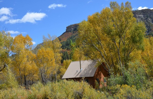 Pagosa Springs Cabin | River Home: secluded log cabin along San Juan River & MONTH-to-MONTH possible!