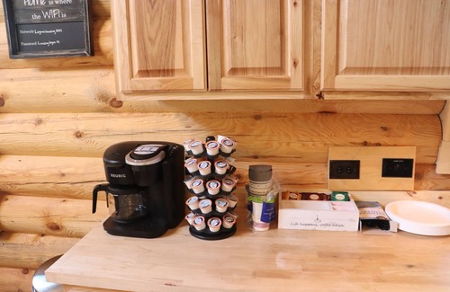 Crystal Falls Cabin | RIVER RENTAL NEW LOG CABIN-POOL SPA ON THE PAINT RIVER-DOCK-CANOES FISH GOLF ORV