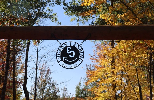 Crystal Falls Cabin | RIVER RENTAL NEW LOG CABIN-POOL SPA ON THE PAINT RIVER-DOCK-CANOES FISH GOLF ORV