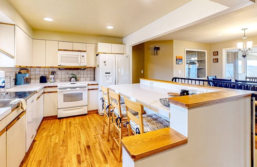 Spokane House | River-view home with yard, enclosed porch, wood stove, & private W/D