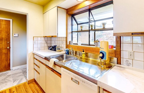 Spokane House | River-view home with yard, enclosed porch, wood stove, & private W/D