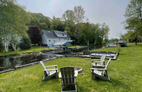 Newaygo House | Riverfront Blissful Cottage