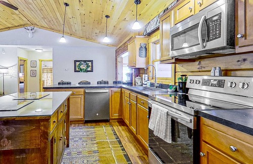 Warrensburg House | Riverfront dog-friendly house near skiing with firepits, wood stove & beach