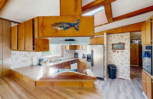 Crescent City House | Riverfront getaway with firepit, deck, fireplace, full kitchen, W/D, & WiFi