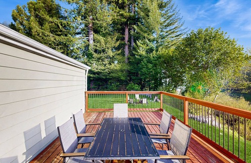 Crescent City House | Riverfront getaway with firepit, deck, fireplace, full kitchen, W/D, & WiFi