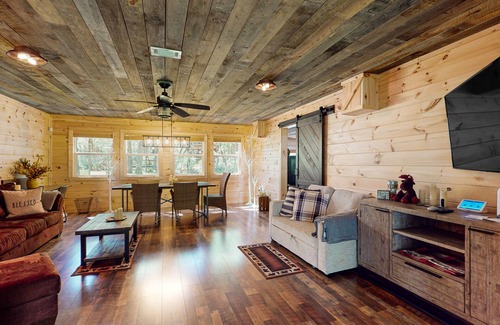 Cherry Log House | Riverfront oasis with hot tub, firepit, game room, & trail access - dog-friendly