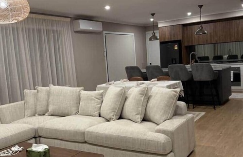 Karaka House | Riverfront Pet Friendly Minimalist Karaka Stay – Close to Motorway