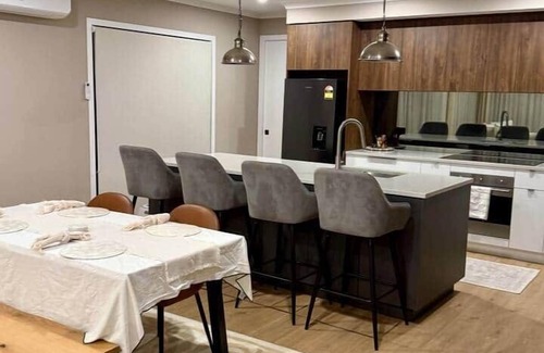 Karaka House | Riverfront Pet Friendly Minimalist Karaka Stay – Close to Motorway