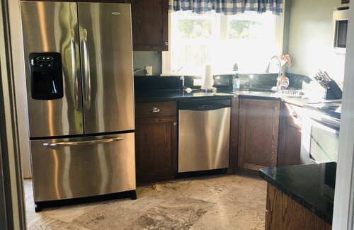 New Port Richey House | Riverfront Plum Crazy Bungalow w/boat dock! 10 min to Gulf, close to beaches!