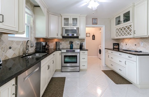 Roseland House | Riverfront Retreat, Private Docks, on Small Acreage.