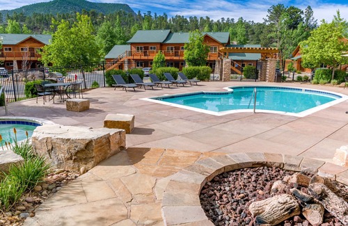 Estes Park Condo | Riverside condo, fish from your patio! Onsite pool & hot tub just steps away.