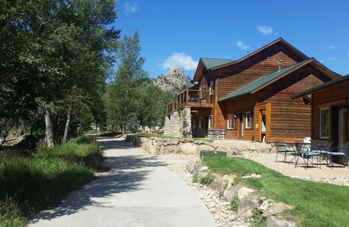 Estes Park Condo | Riverside condo, fish from your patio! Onsite pool & hot tub just steps away.
