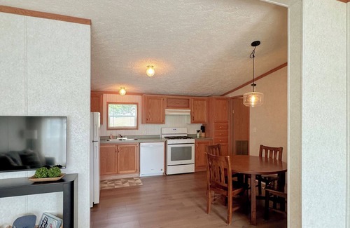 Cheboygan Cottage | Riverside Cottage w/70' Private Dock - 5 Minutes From Town!