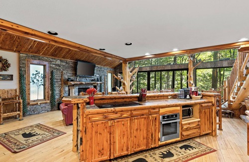 Ellijay Cabin | Riverside Luxury: Hot Tub, Fire Pit & Fishing Dock! Game Room, Fireplace!