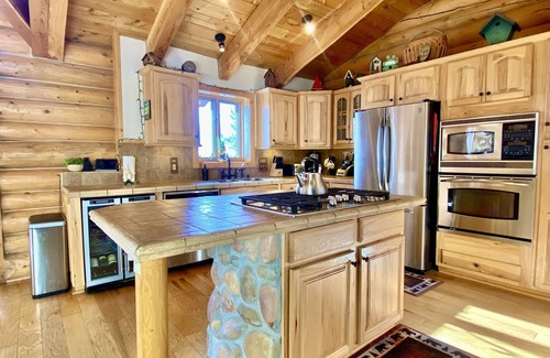 Lake Davis Cabin | RnR Mountaintop Custom Log Home with private pickleball court