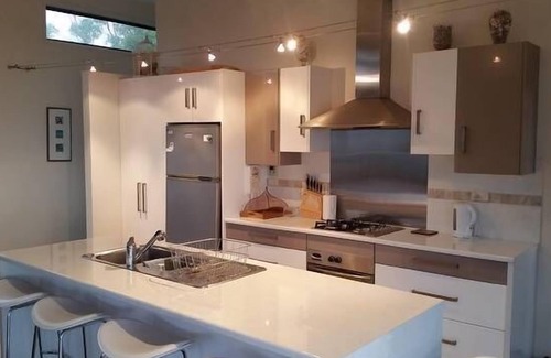 Surveyors Bay House | Roaring Beach Retreat - pet friendly, beachfront