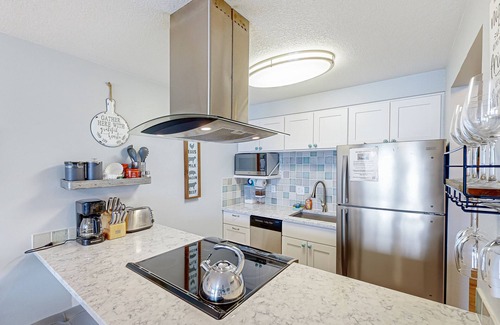 Rockaway Beach Condo | Rock Creek Inn condo on beach with ocean-view balcony - walk to shops & dining