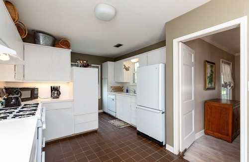 Bay Area House | Romantic 1938 Bay House Steps from Ocean Dr Porches, Gardens & Coastal Charm