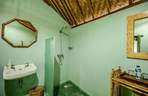 Jasri Resort | Romantic Private Villa facing the pool.Soft aqua handmade tiles and antiques.