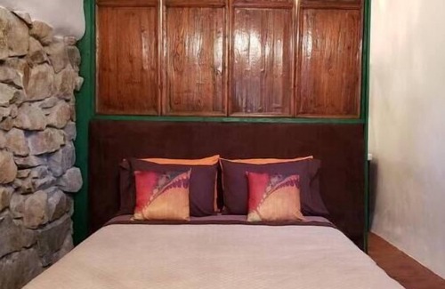Cerrillos House | Romantic, Rock Carriage House, Hot Tub, Woodstove, Kitchen on Historic Property