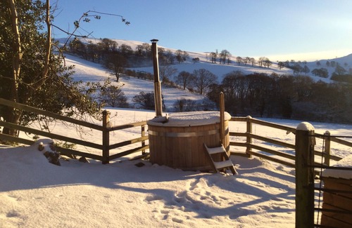 Saint Asaph Cottage | Romantic Stone Cottage with private woodfired hot tub, spa bathroom, yoga deck!