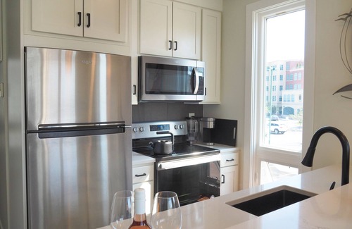 Traverse City Condo | Rooftop Views of West Bay & Downtown! Fantastic condo just steps away from beach
