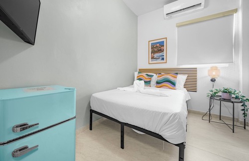 Santurce Hotel | Room 2: Stylish Escape by Calle Cerra Art