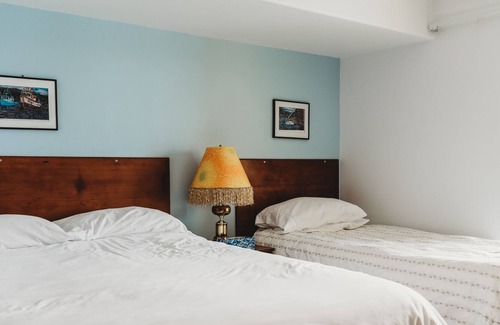 Sointula House | Room 210- Romantic fireplace and balcony