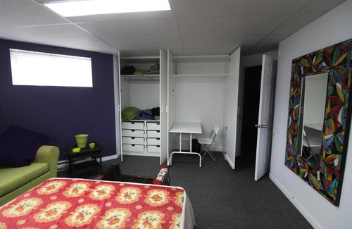 Notre-Dame-des-Monts House | Room in Guest room - Gandhi Very large room decorated in Indian style, office space and sofa
