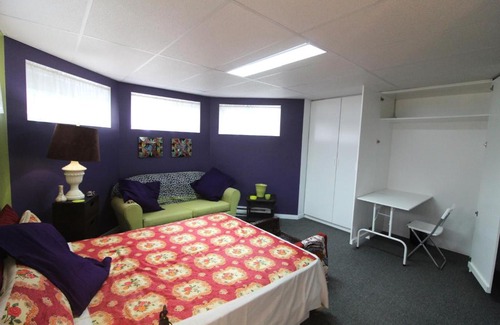 Notre-Dame-des-Monts House | Room in Guest room - Gandhi Very large room decorated in Indian style, office space and sofa
