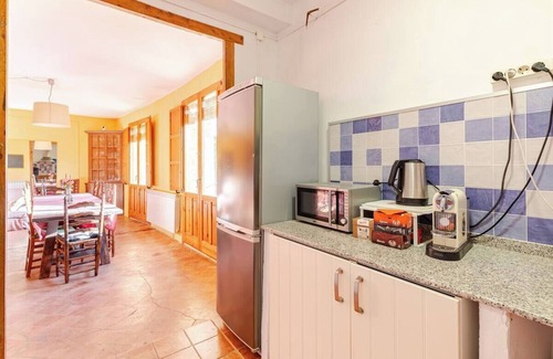 Hoz y Costean Cottage | Room with private bathroom and living room in a rural house