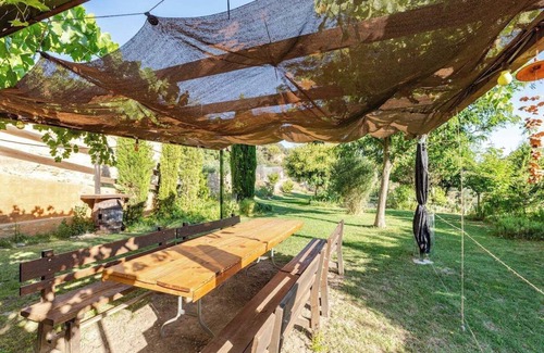 Hoz y Costean Cottage | Room with private bathroom and living room in a rural house