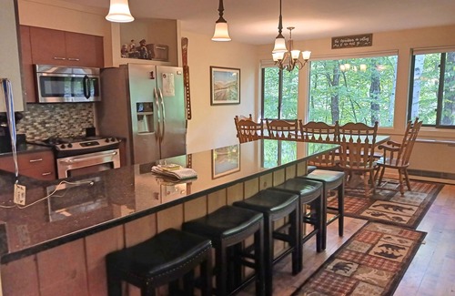 Lincoln House | Roomy, comfy, AC/FP, woods view, pool access, near Loon. C03WU by LRS