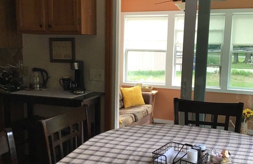 Lake House | Roomy home with spacious fenced in backyard and fire pit.