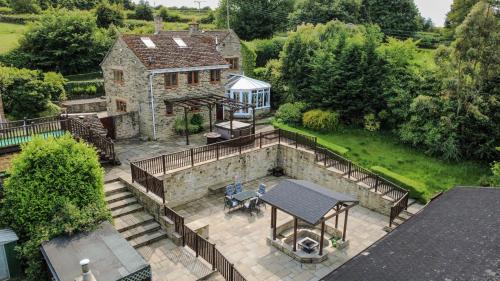 Marsh Lane House | Rural Retreat with Hot Tub, Fire Pit & Games Room