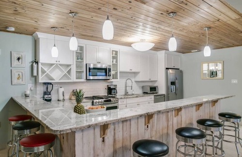 Floridana Beach House | Rustic Beach Front Home - 6 Bedrooms - Private Beach Access - Large Groups