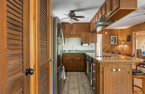 Sunset Cove Cottage | Rustic Cozy Cabin Lakefront Water Trampoline