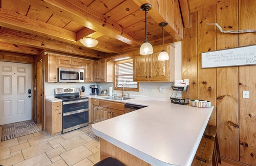 Flat Hollow Marina Cabin | Rustic lakefront retreat with a hot tub, double-deck dock, firepit, grill & deck