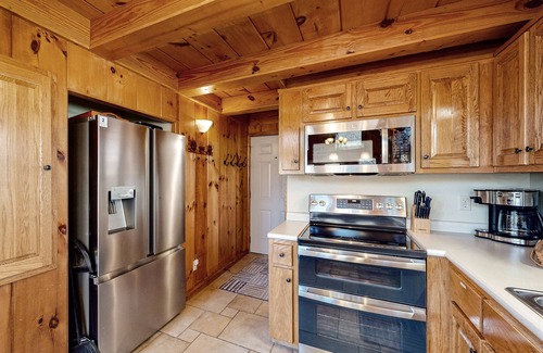 Flat Hollow Marina Cabin | Rustic lakefront retreat with a hot tub, double-deck dock, firepit, grill & deck