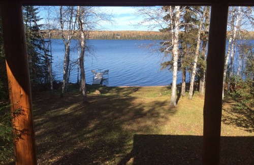 Grand Marais Cabin | Rustic log cabin with large loft 3 total bedrooms rustic log railings