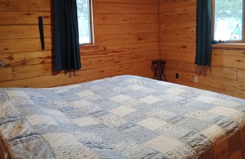 Finlayson House | Rustic Log Lodge Secluded acres with private lake & pond