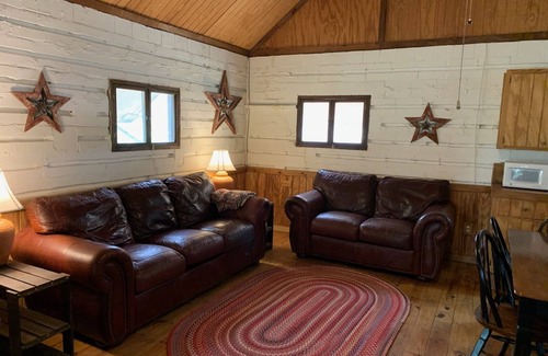Uvalde Cabin | Rustic River Cabin under the Oaks and just a short walk to the river.
