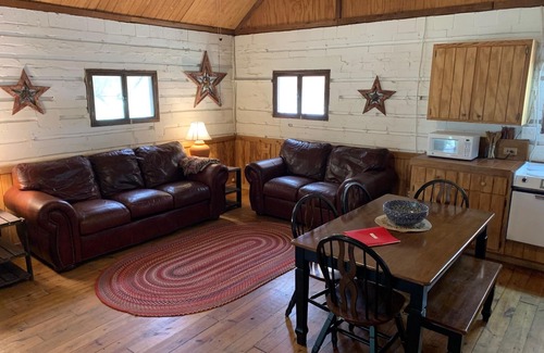 Uvalde Cabin | Rustic River Cabin under the Oaks and just a short walk to the river.