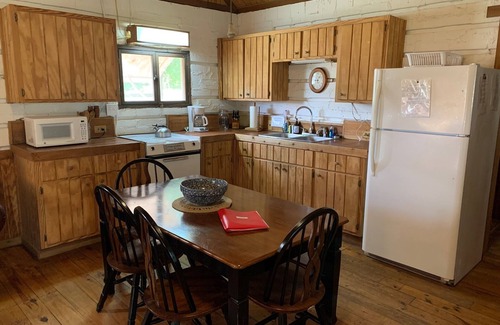 Uvalde Cabin | Rustic River Cabin under the Oaks and just a short walk to the river.