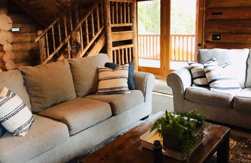 Greenough House | Rustic, spacious, log home nestled into the hillside of 2 acres near river access.