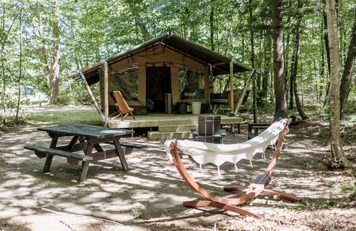 Woodstock RV Rental | Safari Tent Site 11 | 1 King Bed | Woods View