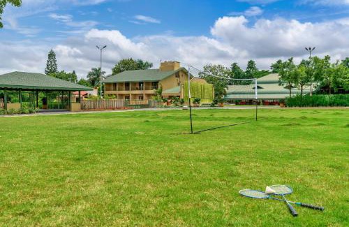 Nashik Villa | SaffronStays Amaltas, Nashik - pool villa with huge lawns perfect for large groups and corporate offsites