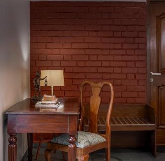 Wai Villa | SaffronStays Red Brick House, Panchgani - rustic villa with huge lawn and terrace